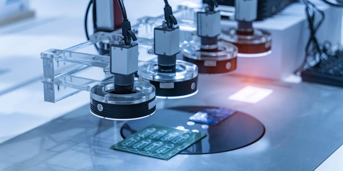 Industrial machine vision inspection system with ring-lit cameras over a PCB